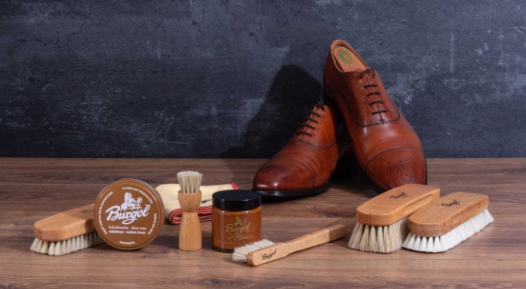 Shoe Cream vs Wax Polish Explained 11 Prepare Your Leather Shoe with horsehair brush, polish cream, on table.