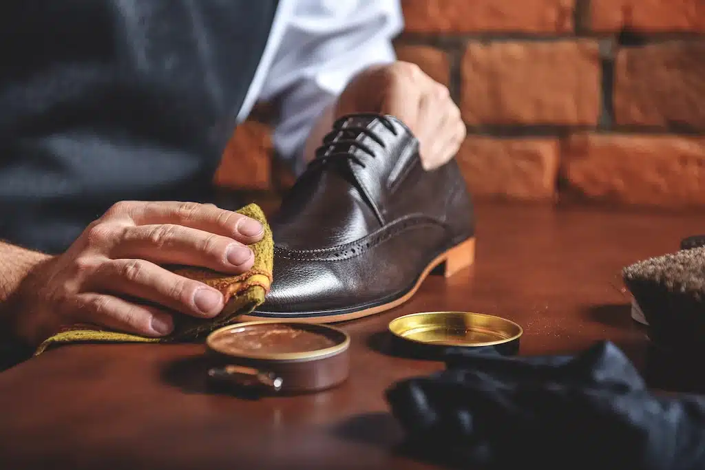 Shoe Cream vs Wax Polish Explained 13 Man polishing show with Wax Shoe Polish